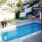 Elegante, moderna, con piscina